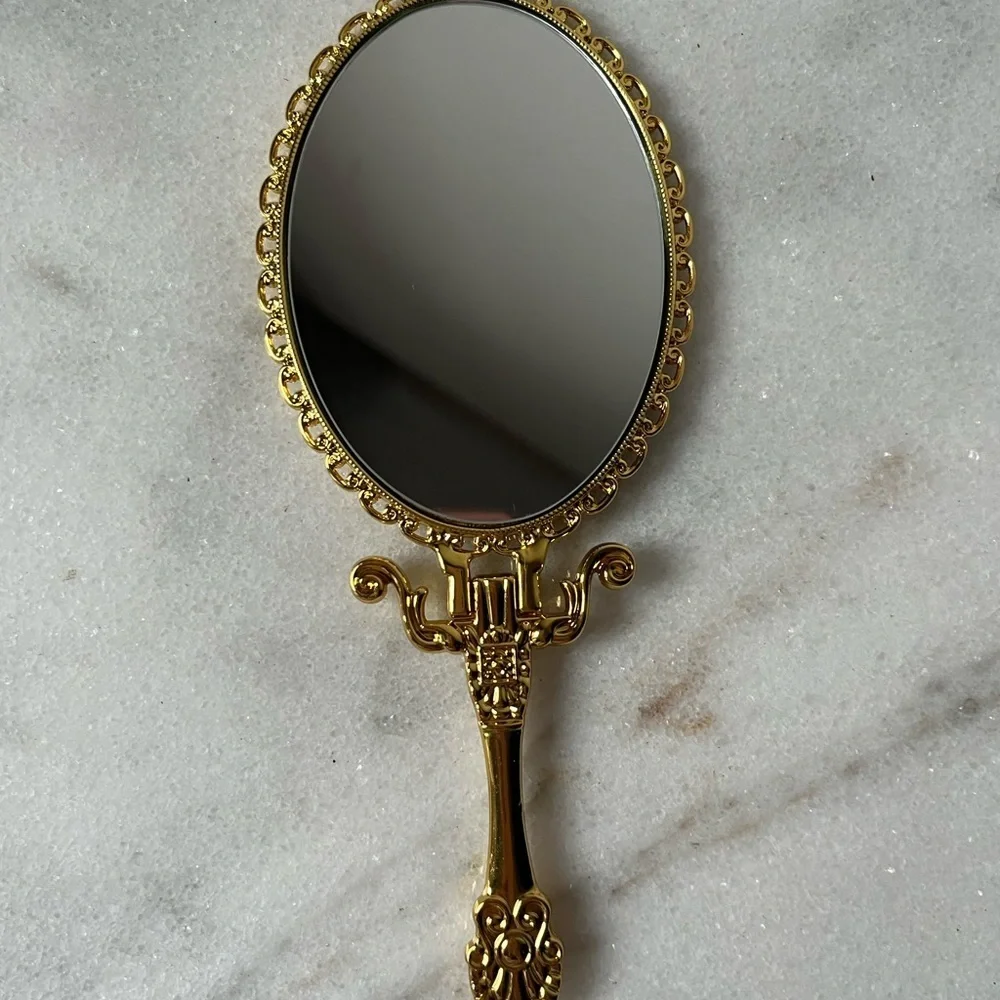 Izzy and Liv gold Fold Away Hand Mirror adjustable